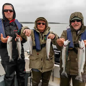 An angler from Dublin with a lovely sea trout taken fishing close to Bartragh Island. July 2014.