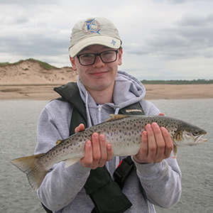 A nice sea trout for this young angler.
