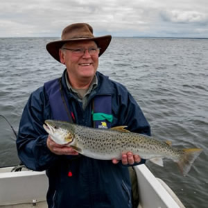 An English visitor with a beautiful sea trout of 4 1/2 pounds. July 2011.